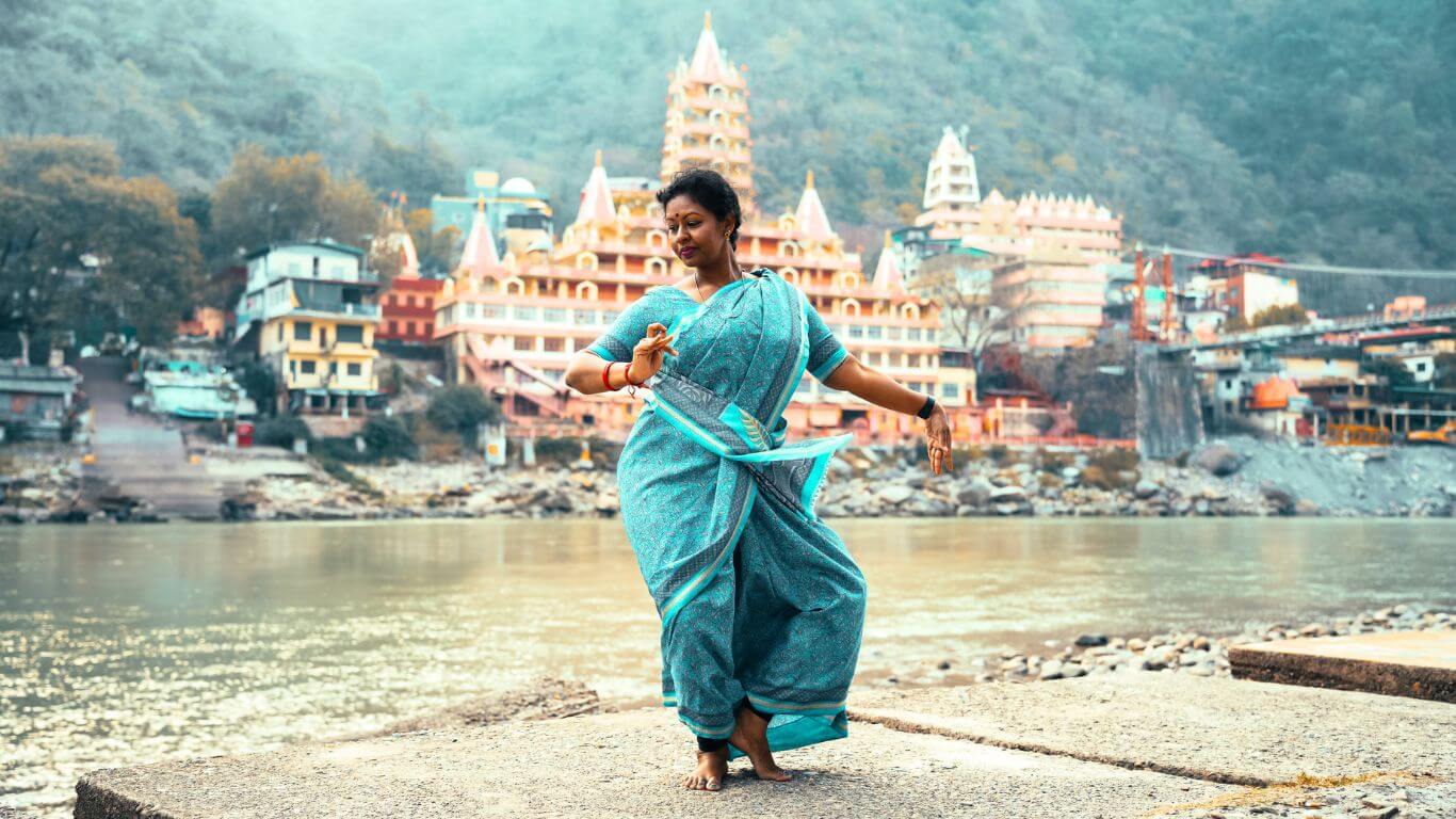 Yogini doing natraj pose in rishikesh