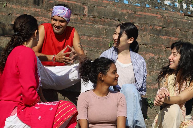 Yoga Teacher Trainee having conversation with yoga teacher trainer kamal negi