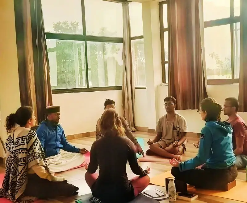 Yoga students participating in meditation session during the 100 Hour Yoga Teacher Training at Rishikesh Yoga Valley, India