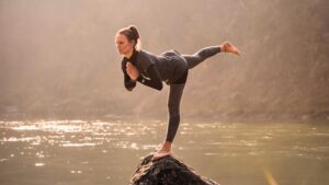 Yogini doing yoga asana in Rishikesh