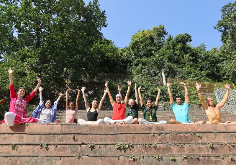 Yoga students enjoying day near ganga ma