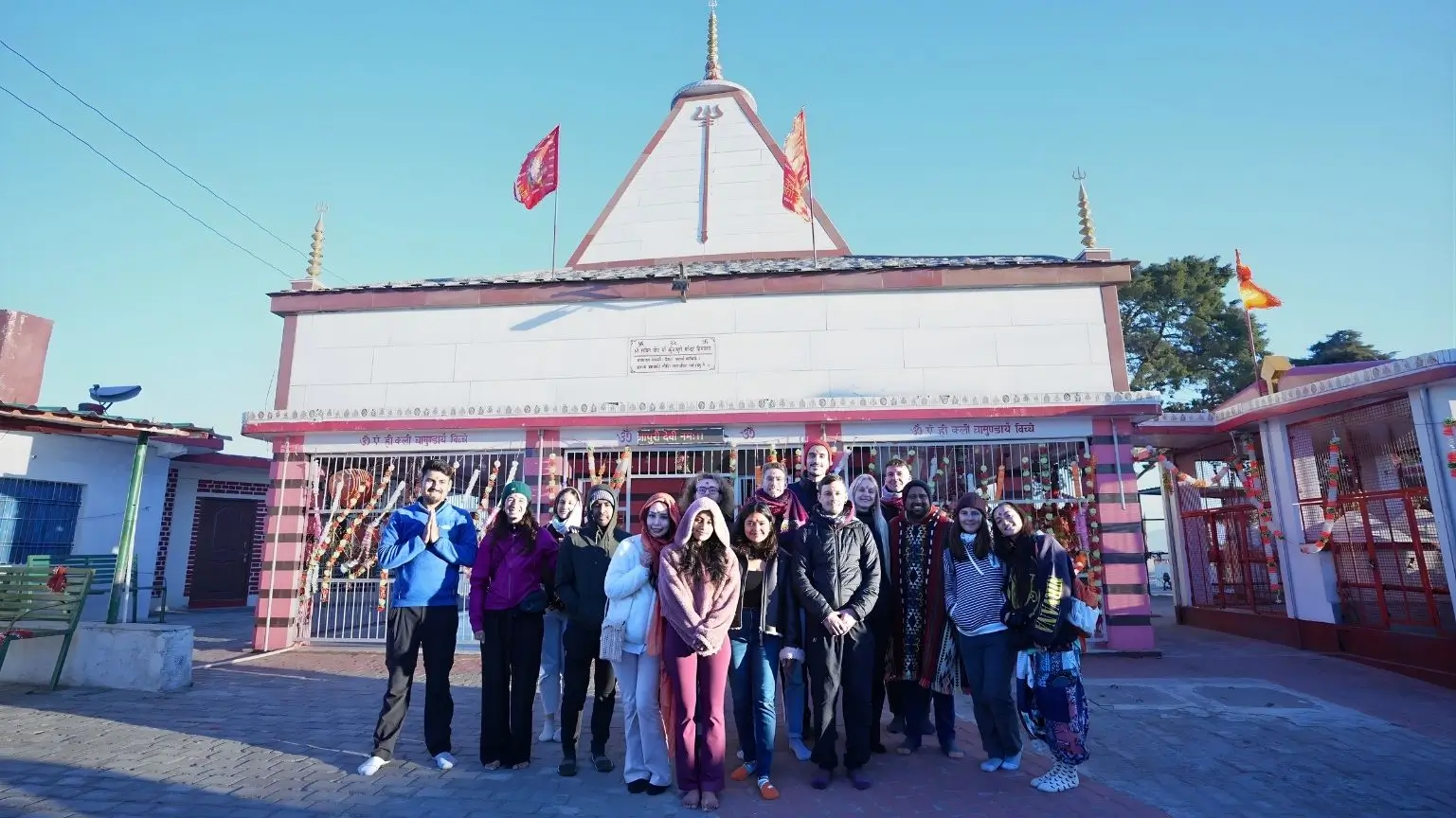 Group of people standing front of Kunjapoori Shaktipeeth Temple