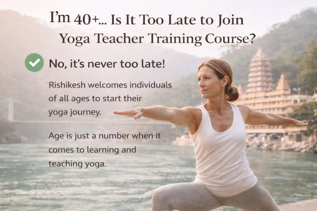 A woman practicing Warrior II pose by the Ganges river in Rishikesh, proving that a 40 plus year old can do yoga teacher training to start a new career or deepen their practice.
