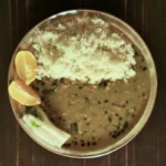 Traditional Indian sattvic dal and rice meal served during 50 hour yoga teacher training in Rishikesh, India.