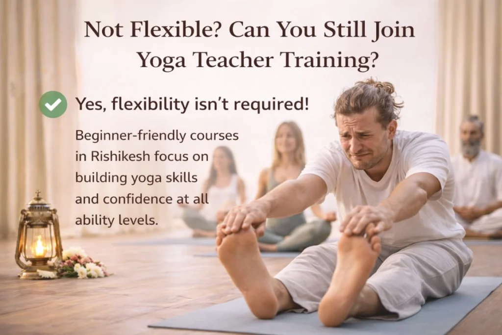 A man practicing a seated forward fold in a studio setting, illustrating how a student who are not flexible can join yoga TTC guide to begin their training in Rishikesh.