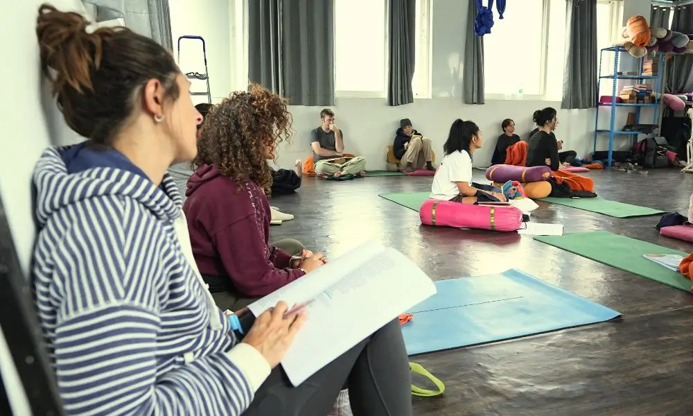 students attending yoga and ayurveda theory session during ayurveda retreats in rishikesh india