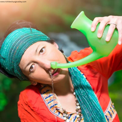 Woman performing Jala Neti nasal cleansing using neti pot for sinus relief and better breathing