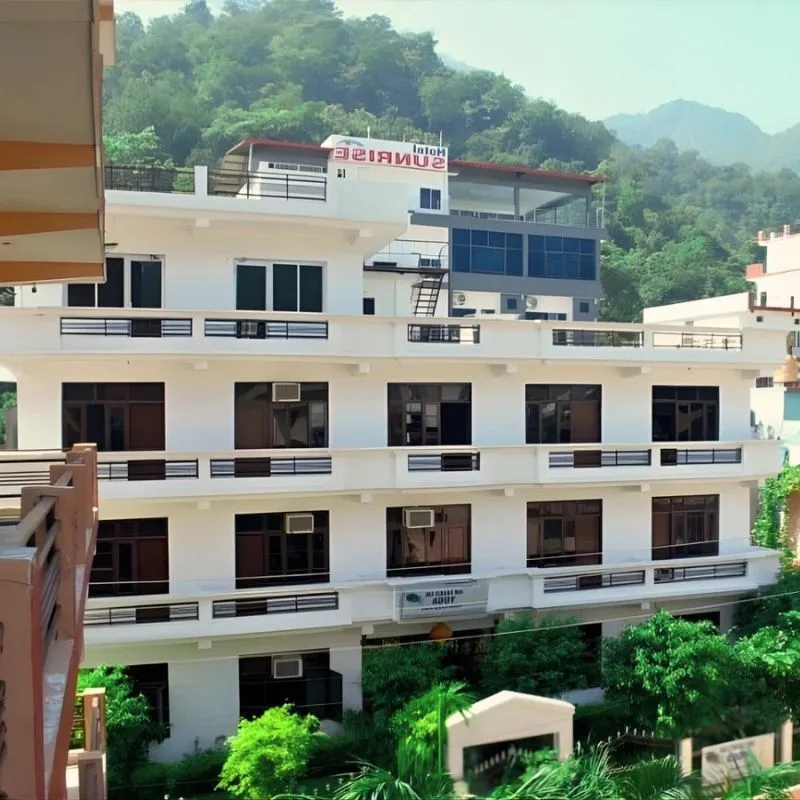 Yoga teacher training school building in Rishikesh India surrounded by mountains for 50 Hour Yoga TTC program
