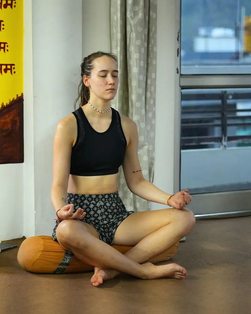 A student practicing meditation during a 100 hour yoga teacher training in Rishikesh, India.