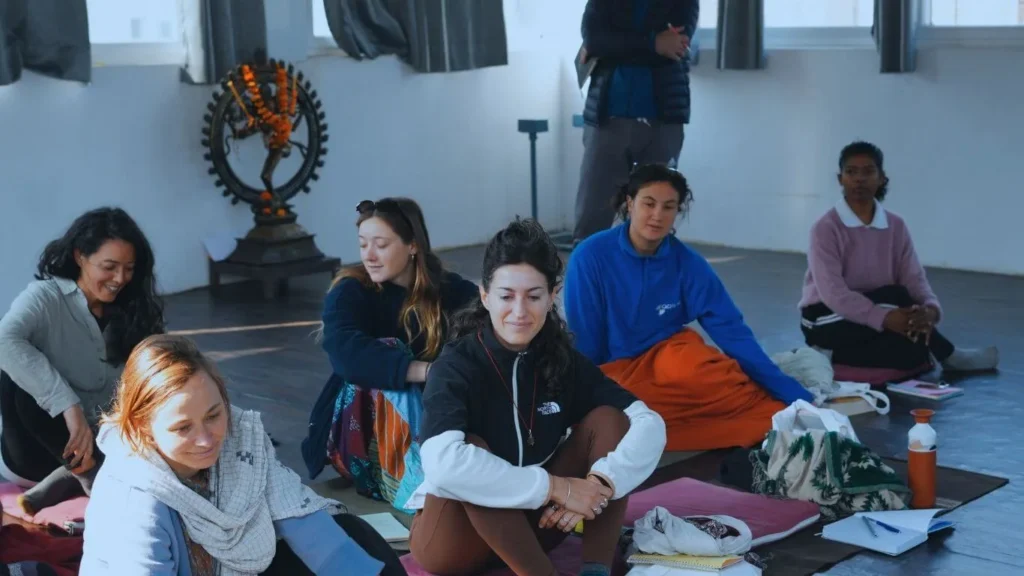 International yoga students participating in a discussion session during a 500 hour Yoga Teacher Training in Rishikesh India.