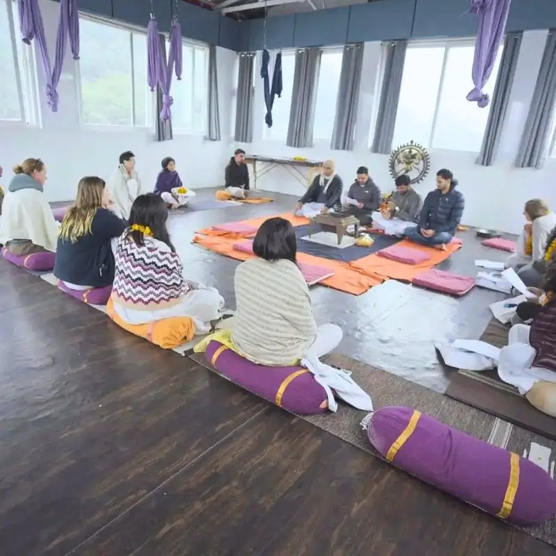 SEO Alt Text: International students participating in an opening ceremony during a 500 hour Yoga Teacher Training in Rishikesh India.