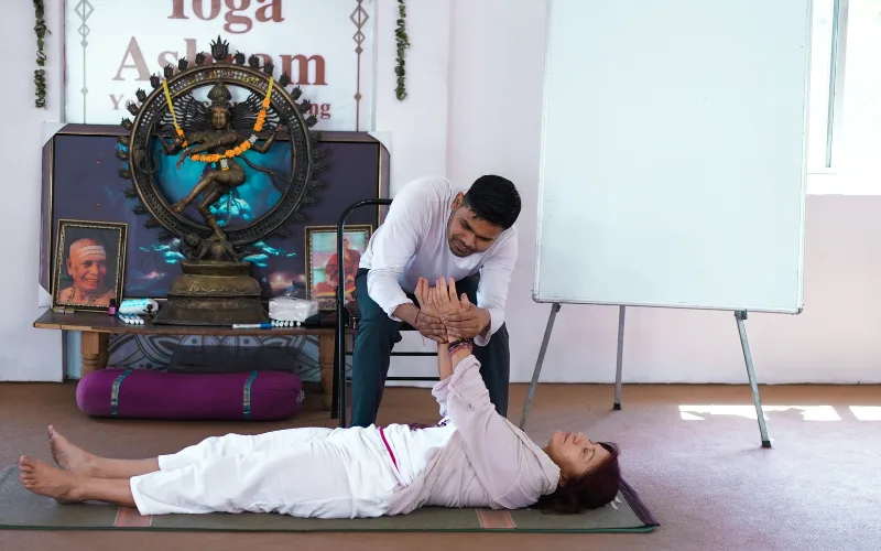 Yoga alignment and therapy session at an Ayurveda and yoga retreat in Rishikesh.