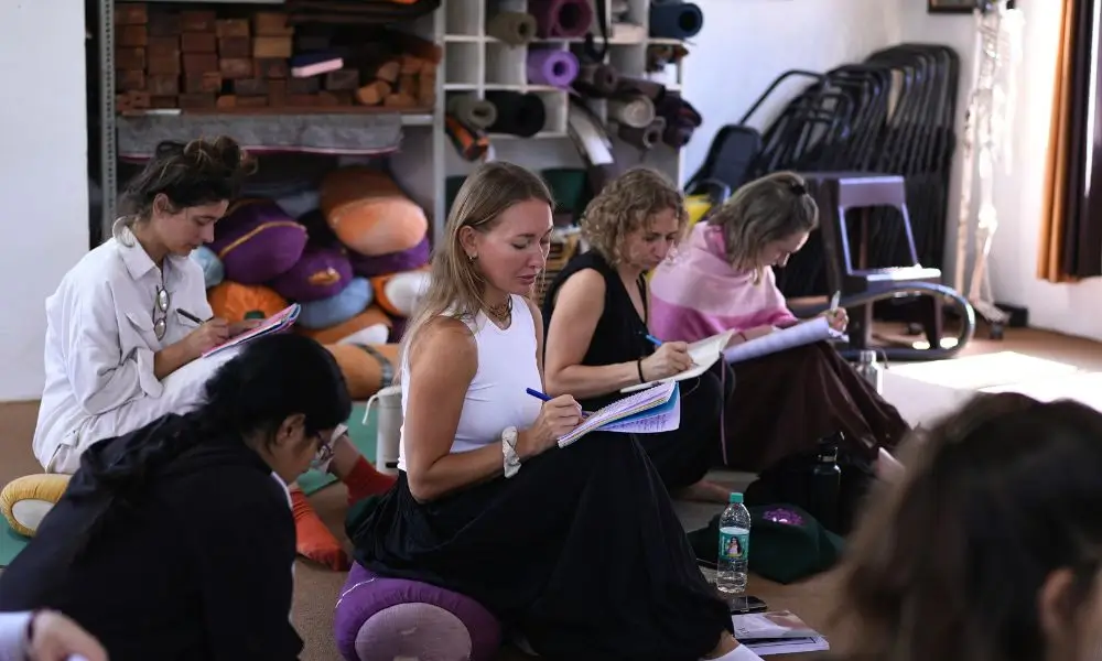 Students learning about yoga during their yoga teacher training in rishikesh india at Rishikesh Yoga Valley School