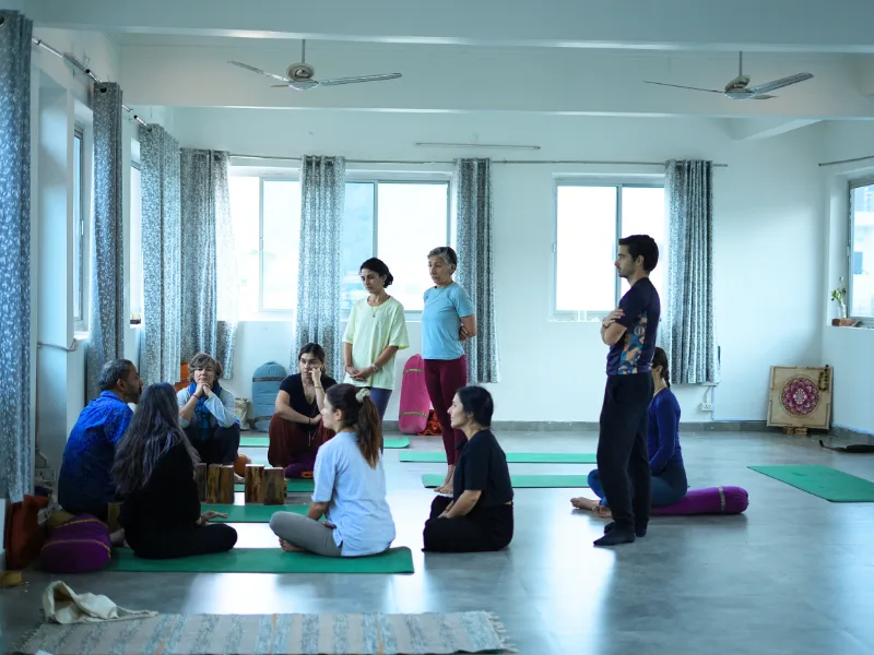 Participants attending a group yoga session during a 10 Days Yoga Retreat in Rishikesh