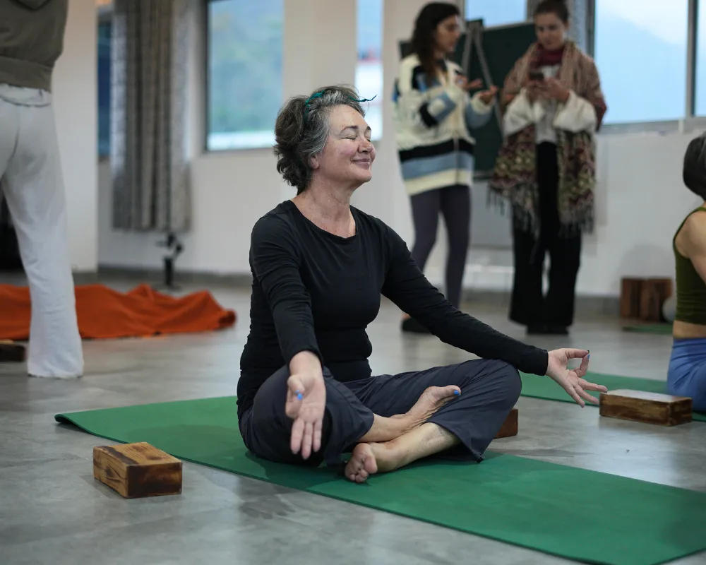 Participant practicing seated meditation during a 10 Days Yoga Retreat in Rishikesh