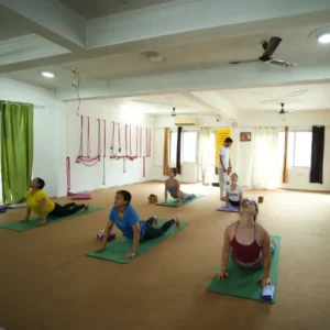 Neeraj Rayal teaching Ashtanga Yoga poses to students during a 10 Days Yoga Retreat in Rishikesh