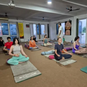 Upendra Silswal guiding students in a Pranayama meditation session during a 10 Days Yoga Retreat in Rishikesh
