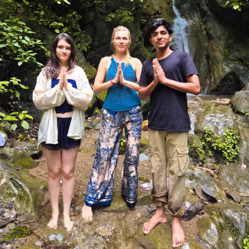 Yoga retreat participants enjoying a waterfall excursion during a 10 Days Yoga Retreat in Rishikesh