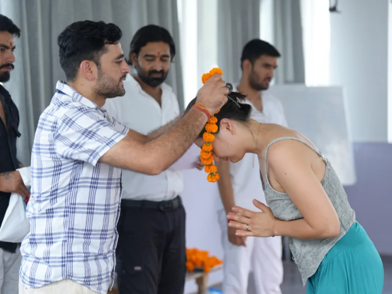 Participant receiving a traditional welcome blessing during a 10 Days Yoga Retreat in Rishikesh