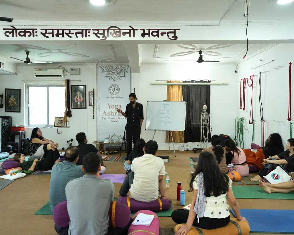 Participants attending a yoga philosophy class during a 10 Days Yoga Retreat in Rishikesh