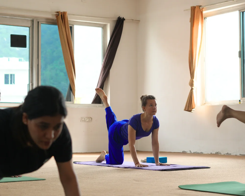 Woman practicing yoga during a 10 Days Yoga Retreat in Rishikesh