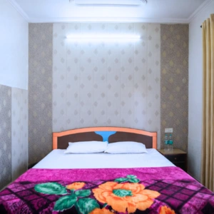 Clean and comfortable private double bedroom accommodation for students attending the 200 hour Kundalini yoga teacher training in Rishikesh.
