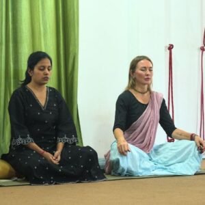 200 hour yoga teacher training student doing breathing technique in Rishikesh Yoga Valley hall