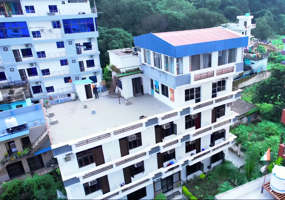 Yoga retreat center surrounded by lush greenery for a 6 Days Nature and Yoga Retreat in Rishikesh