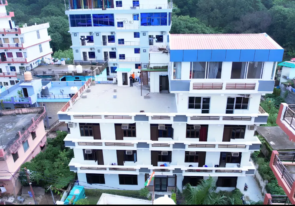 Yoga retreat center surrounded by lush greenery for a 6 Days Nature and Yoga Retreat in Rishikesh