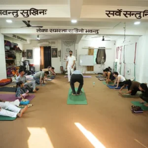 Neeraj Rayal teaching Ashtanga Yoga to students during a group class at a 7 Days Yoga Retreat in Rishikesh