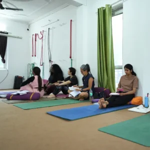 Students learning Ayurveda from Rakesh during a 7 Days Yoga Retreat in Rishikesh