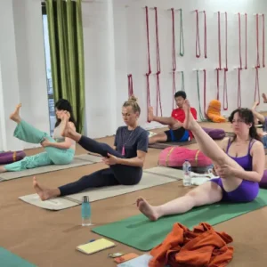 Rohit Kamboj guiding students through seated Hatha Yoga stretches during a 7 Days Yoga Retreat in Rishikesh