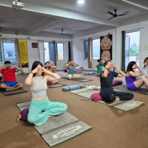 Upendra Silswal guiding students through Pranayama breathing techniques during a 7 Days Yoga Retreat in Rishikesh
