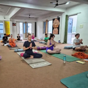 Upendra Silswal guiding students in a seated Pranayama and meditation practice during a 7 Days Yoga Retreat in Rishikesh