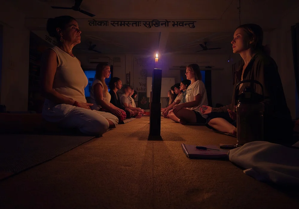 Group practicing candle meditation as part of techniques in meditation