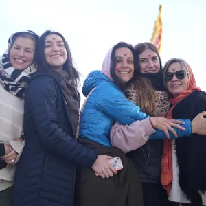 Group of smiling students hugging during a sound healing course in Rishikesh