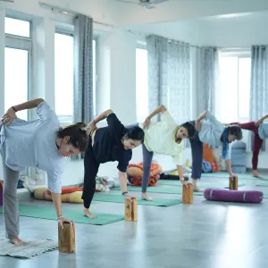 Students practicing yoga during a sound healing course in Rishikesh