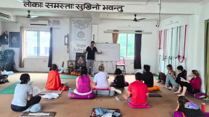 Students attending a yoga and Ayurveda session during a 10 Day Ayurveda Retreat in Rishikesh