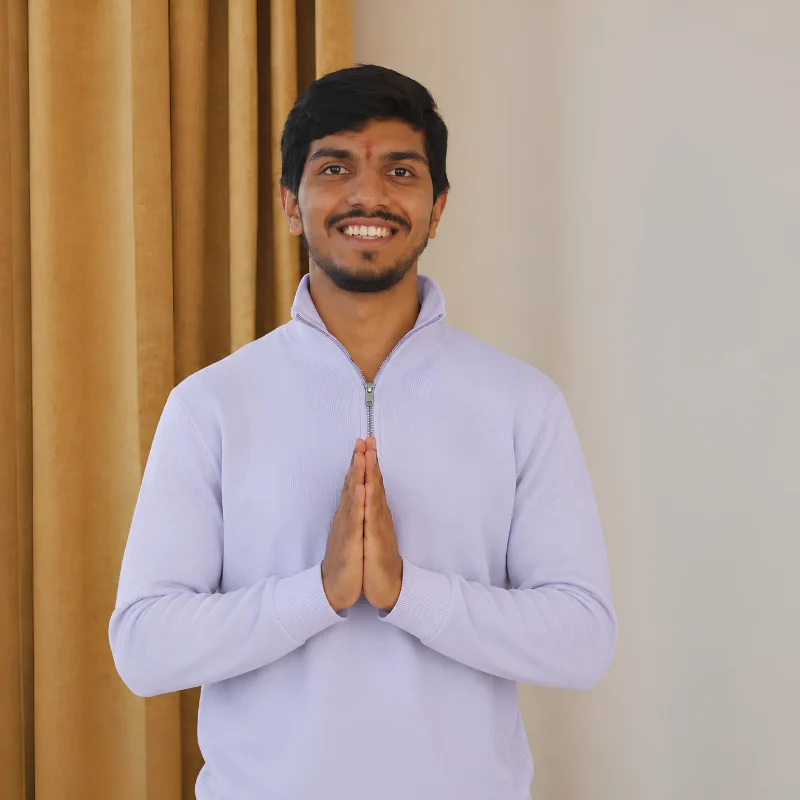 Prashant Negi, yoga training course teacher in Rishikesh, India, greeting with a traditional Namaste gesture